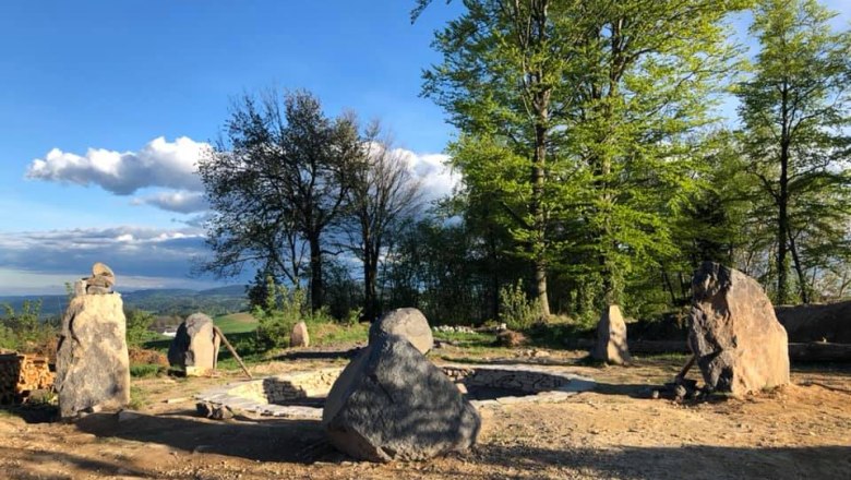 Power place evening, © Kloster NaturSinne Stone circle in a forest clearing at sunset.